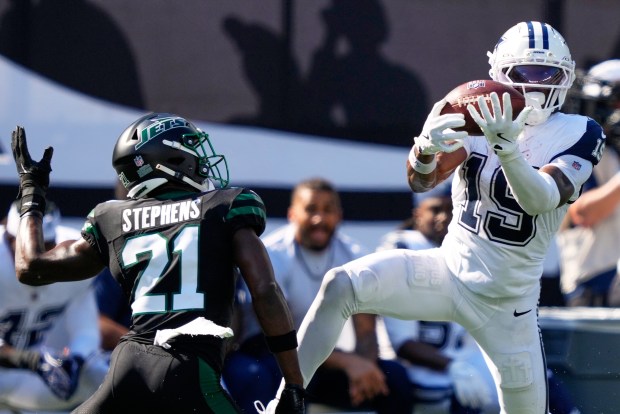 Dallas Cowboys' Ryan Flournoy catches a pass in front of New York Jets' Brandon Stephens during the first half of an NFL football game Sunday, Oct. 5, 2025, in East Rutherford, N.J. (AP Photo/Yuki Iwamura)