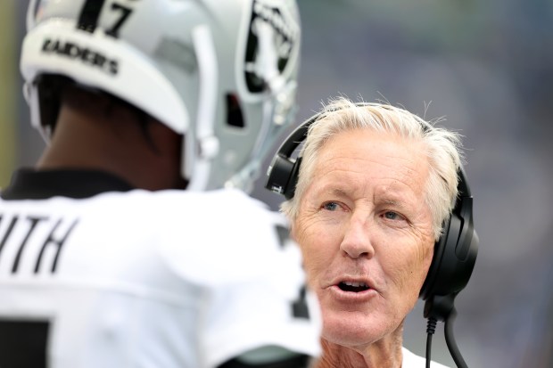 Head coach Pete Carroll of the Las Vegas Raiders talks with Geno Smith #7 during the NFL Preseason 2025 game between Las Vegas Raiders and Seattle Seahawks at Lumen Field on Aug. 07, 2025 in Seattle, Washington. (Photo by Steph Chambers/Getty Images)
