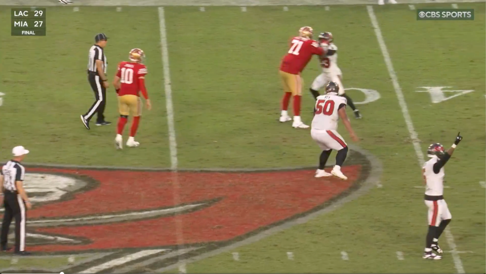 Tykee Smith tries to block Trent Williams