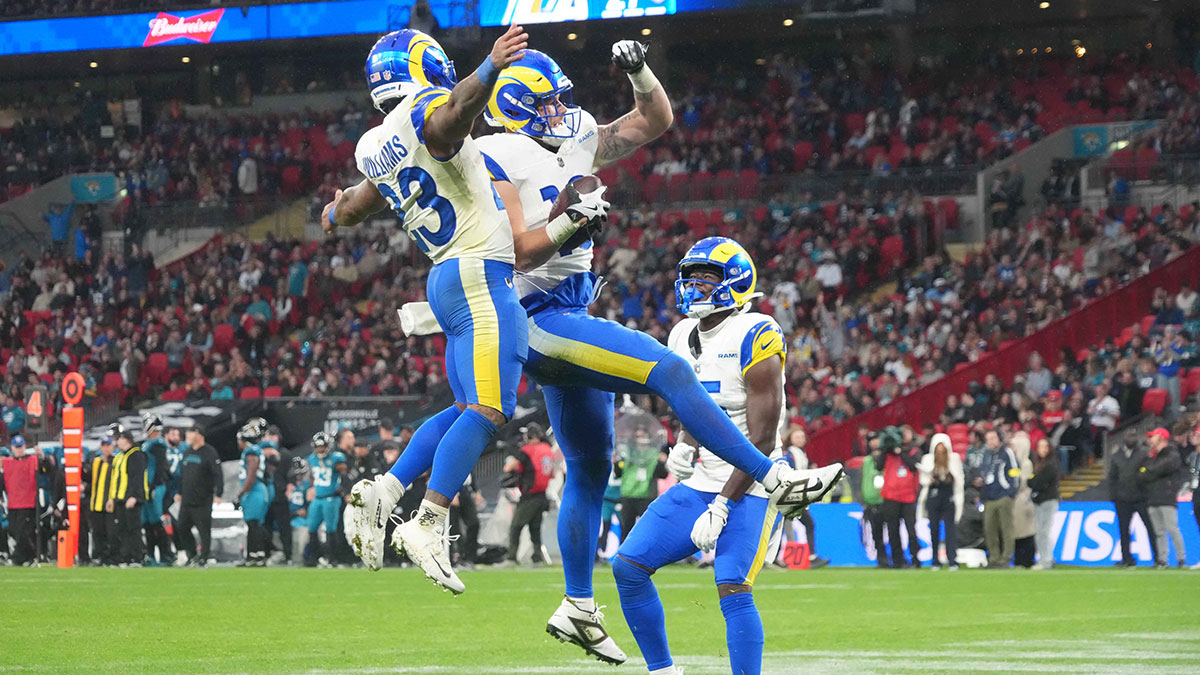 Los Angeles Rams tight end Terrance Ferguson (18) celebrates with running back Kyren Williams (23) as wide receiver Konata Mumpfield (15) watches after scoring on a 31-yard touchdown reception in the fourth quarter against the Jacksonville Jaguars during a NFL International Series game at Wembley Stadium.