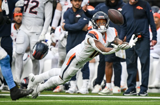 Courtland Sutton (14) of the Denver Broncos cannot haul in a deep pass from Bo Nix (10) with the game on the line during the fourth quarter of the Los Angeles Chargers' 23-20 win at SoFi Stadium in Inglewood, California on Sunday, Sept. 21, 2025. (Photo by AAron Ontiveroz/The Denver Post)