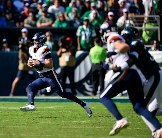 Denver Broncos quarterback Bo Nix (10) runs on a keeper against the Philadelphia Eagles in the third quarter at Lincoln Financial Field in Philadelphia, Pennsylvania, on Sunday, Oct. 5, 2025. (Photo by Andy Cross/The Denver Post)