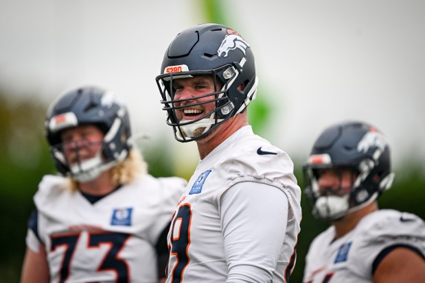 Mike McGlinchey (69) of the Denver Broncos laughs during practice at Tottenham Hotspur Training Ground in Enfield Town, England on Thursday, Oct. 9, 2025. (Photo by AAron Ontiveroz/The Denver Post)