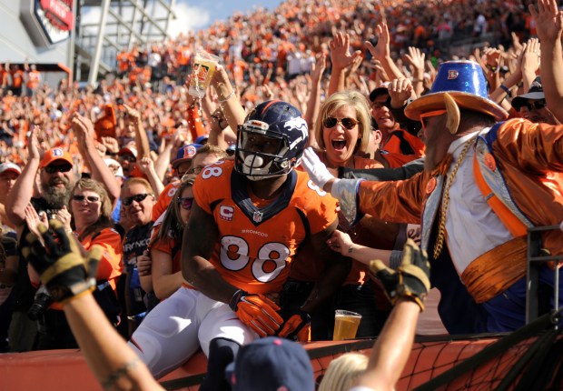 Demaryius Thomas (88) of the Denver Broncos jumps in to the stands after scoring a touchdown in a game against the Arizona Cardinals at Sports Authority Field at Mile High in Denver on Oct. 5, 2014. (Photo by Joe Amon/The Denver Post)