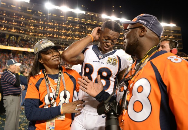 Demaryius Thomas (88) of the Denver Broncos leaves the field with his mom, Katina Smith, and dad, Bobby Thomas, after beating the Carolina Panthers 24-10 in Super Bowl 50 at Levi's Stadium in Santa Clara, Calif., on Feb. 7, 2016. (Photo by AAron Ontiveroz/The Denver Post)