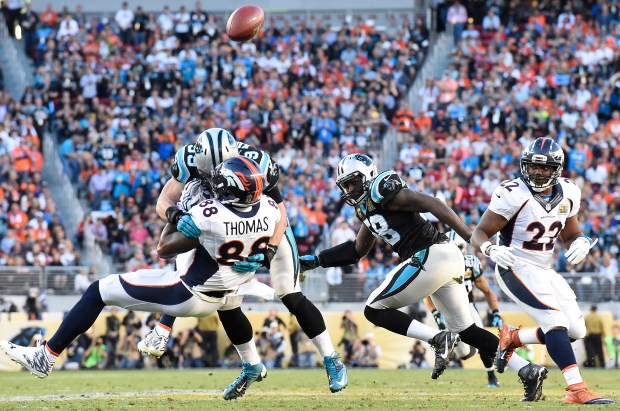 Luke Kuechly (59) of the Carolina Panthers slams Demaryius Thomas (88) of the Denver Broncos to the ground on an incomplete pass in the second quarter of Super Bowl 50 at Levi's Stadium in Santa Clara, Calif., on Feb. 7, 2016. (Photo by Joe Amon/The Denver Post)