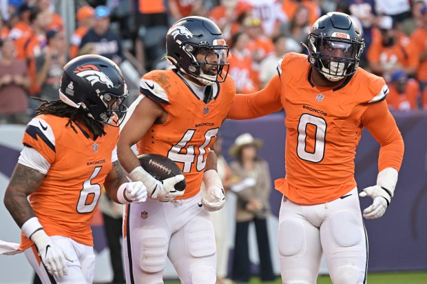 Denver Broncos Justin Strnad (4) celebrates his interception from New...