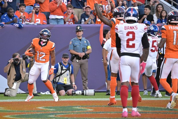 Denver Broncos RJ Harvey scores a touchdown in the 4th...