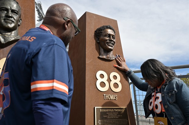 Demaryius Thomas' parents, Bobby Thomas, left, and Katina Smith unveiled...