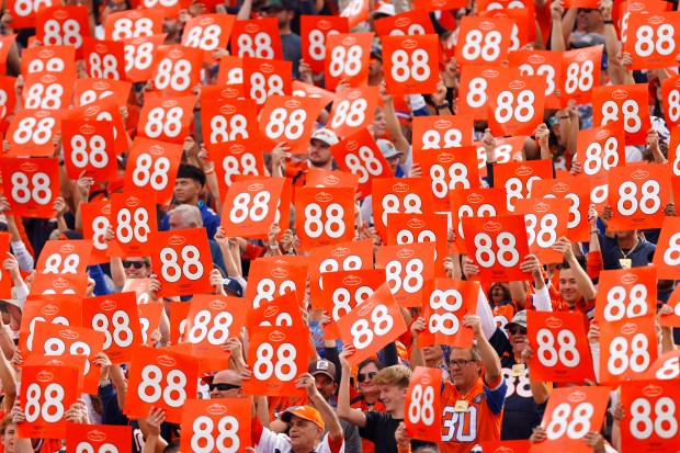 Denver Broncos fans hold up signs commemorating the late Demaryius...
