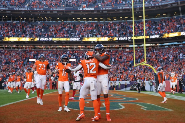 Courtland Sutton #14 and RJ Harvey #12 of the Denver...