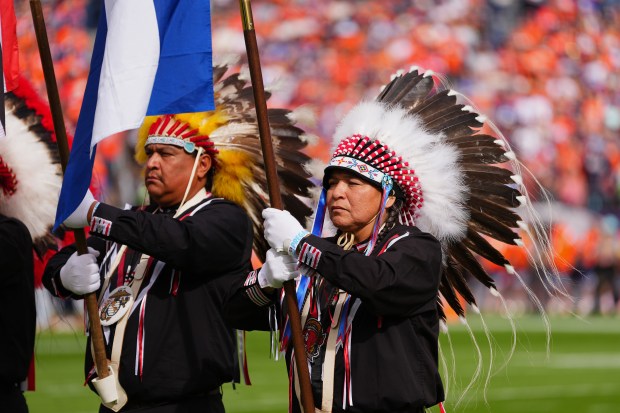 The color guard is shown during the national anthem before...
