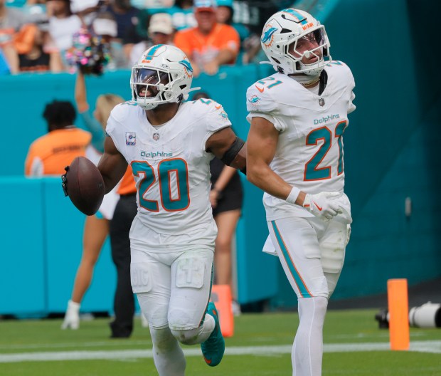 Miami Dolphins linebacker Jordyn Brooks celebrates a fumble recovery Sunday,...