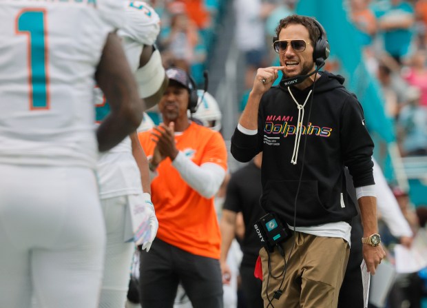 Miami Dolphins coach Mike McDaniel reacts to a touchdown by...