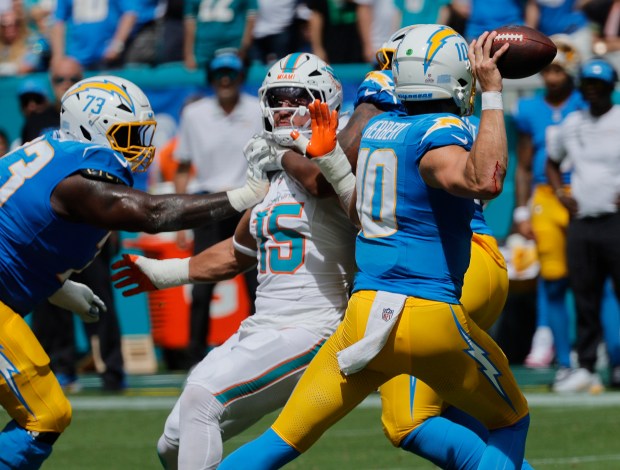 Miami Dolphins linebacker Jaelan Phillips is blocked by Los Angeles...