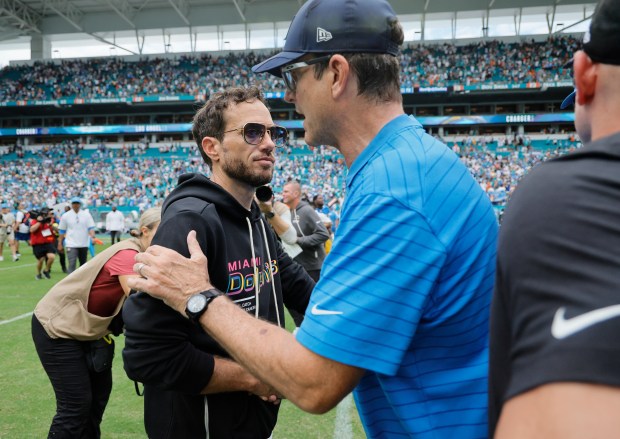 Miami Dolphins coach Mike McDaniel meets Los Angeles Chargers coach...