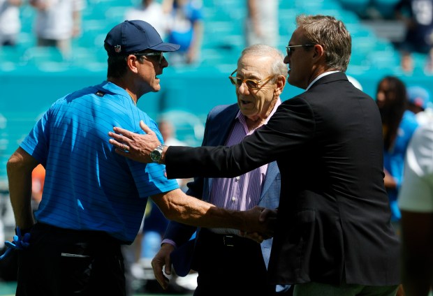 Los Angeles Chargers head coach Jim Harbaugh meets with Miami...