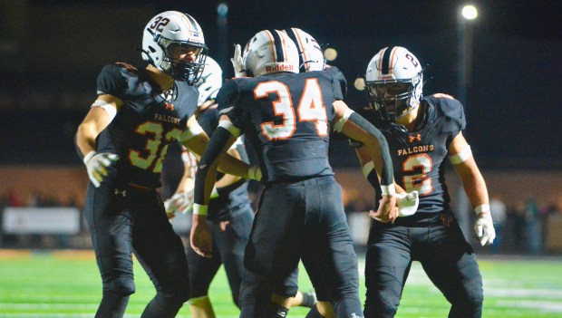 Pennsbury running back Luke Beighley, 34, celebrates with teammates Justin...