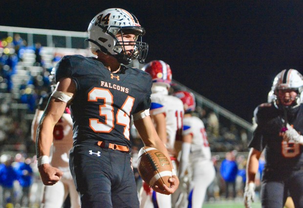 Pennsbury running back Luke Beighley, 34, reacts to scoring a...