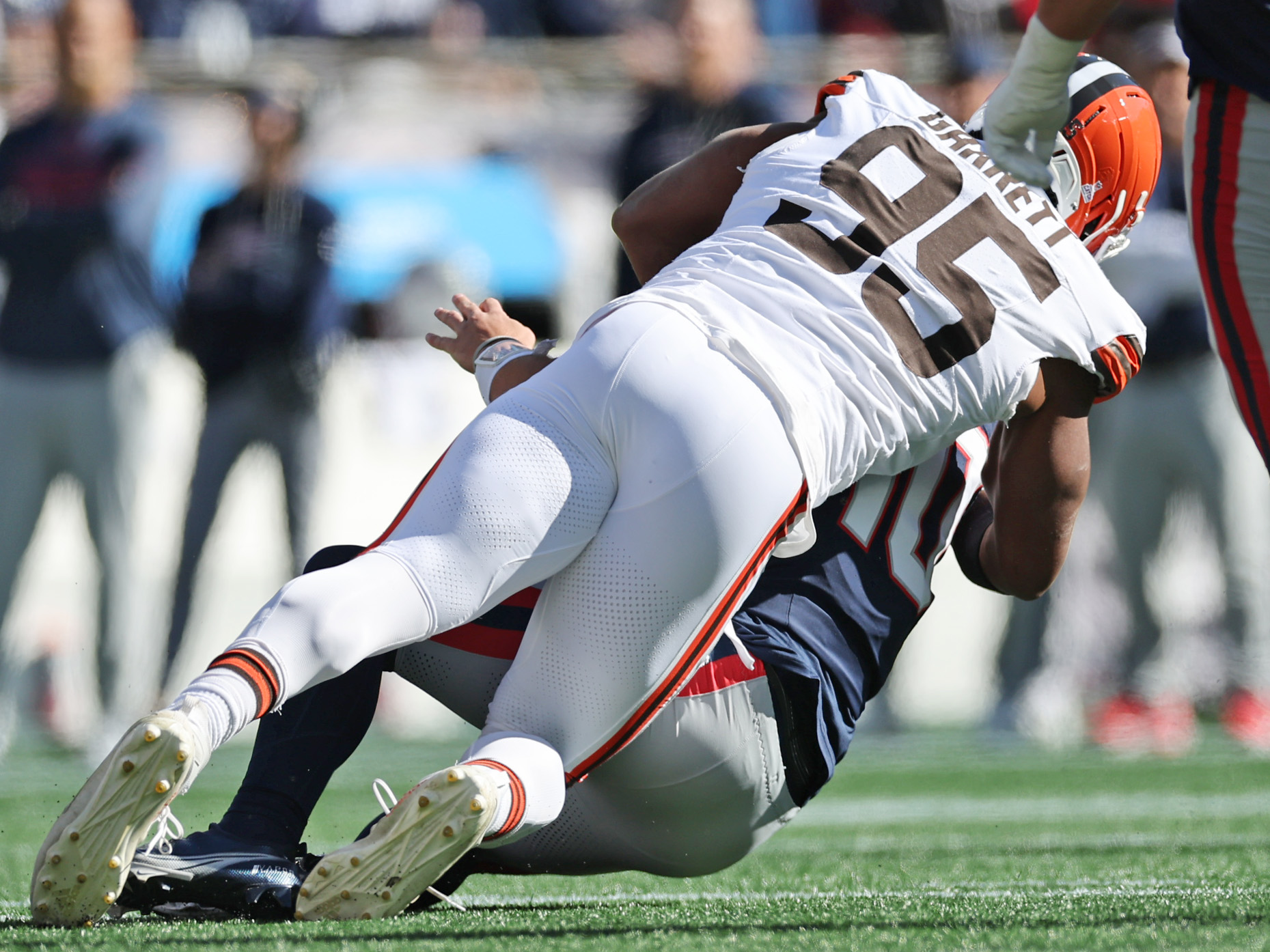Cleveland Browns defensive end Myles Garrett sacks New England Patriots quarterback Drake Maye in the first quarter.  