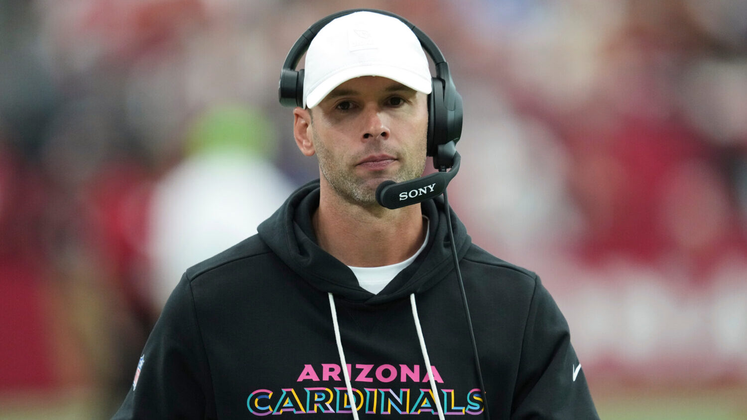 Arizona Cardinals head coach Jonathan Gannon walks the sideline during the first half of an NFL foo...