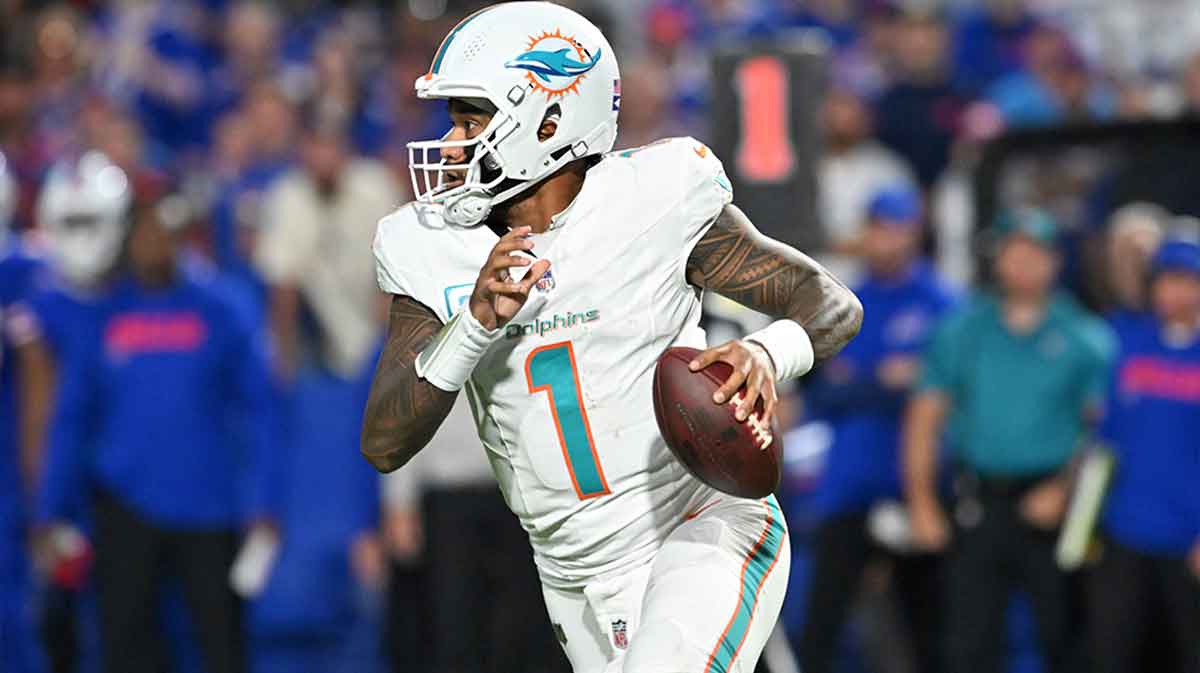 Miami Dolphins quarterback Tua Tagovailoa (1) runs the ball against the Buffalo Bills in the second quarter at Highmark Stadium.