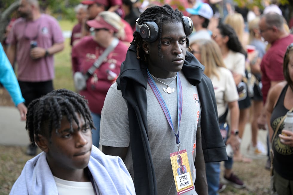 FILE - Seminole linebacker Ethan Pritchard walks to the stadium before an NCAA college...
