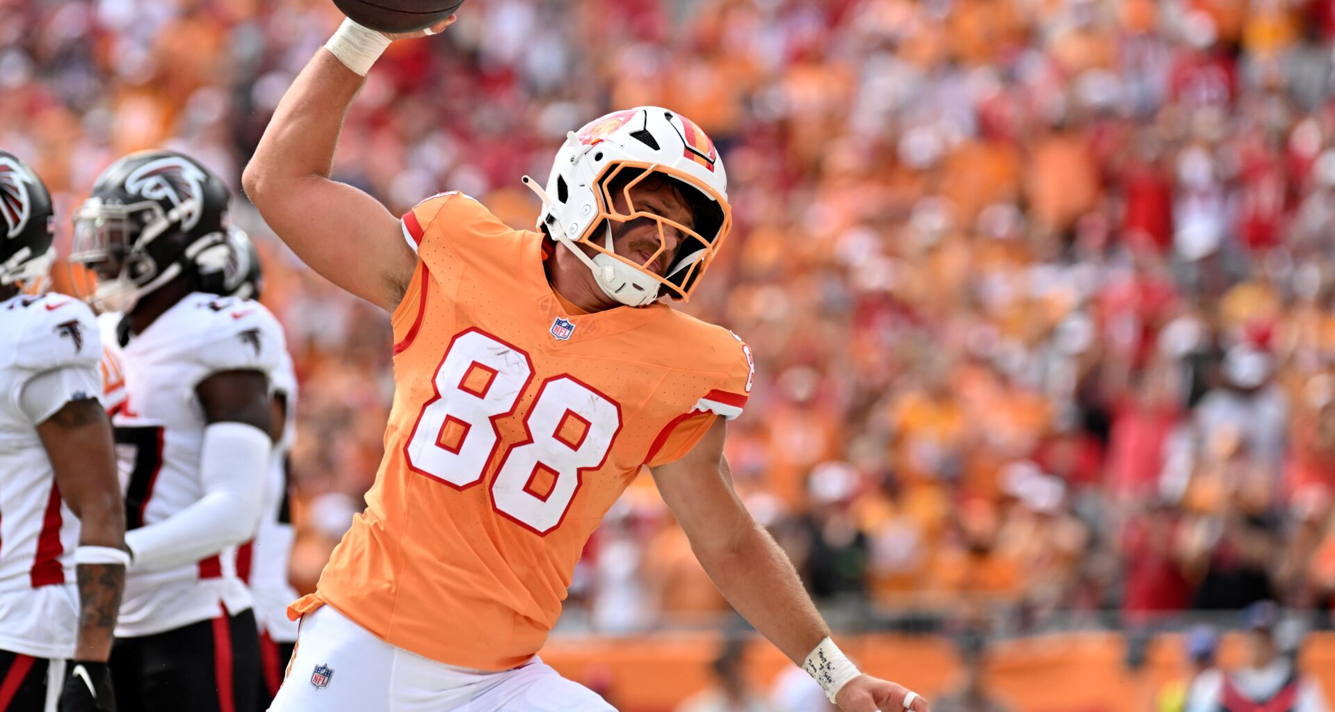 Oct 27, 2024; Tampa, Florida, USA; Tampa Bay Buccaneers tight end Cade Otton (88) spikes the ball after scoring a touchdown in the first half against the Atlanta Falcons at Raymond James Stadium. Mandatory Credit: Jonathan Dyer-Imagn Images