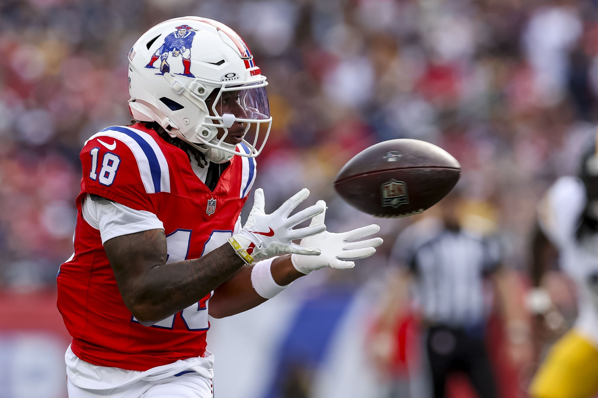 Sep 21, 2025; Foxborough, Massachusetts, USA; New England Patriots wide receiver Kyle Williams (18) completes a pass during the third quarter at Gillette Stadium. Mandatory Credit: Paul Rutherford-Imagn Images