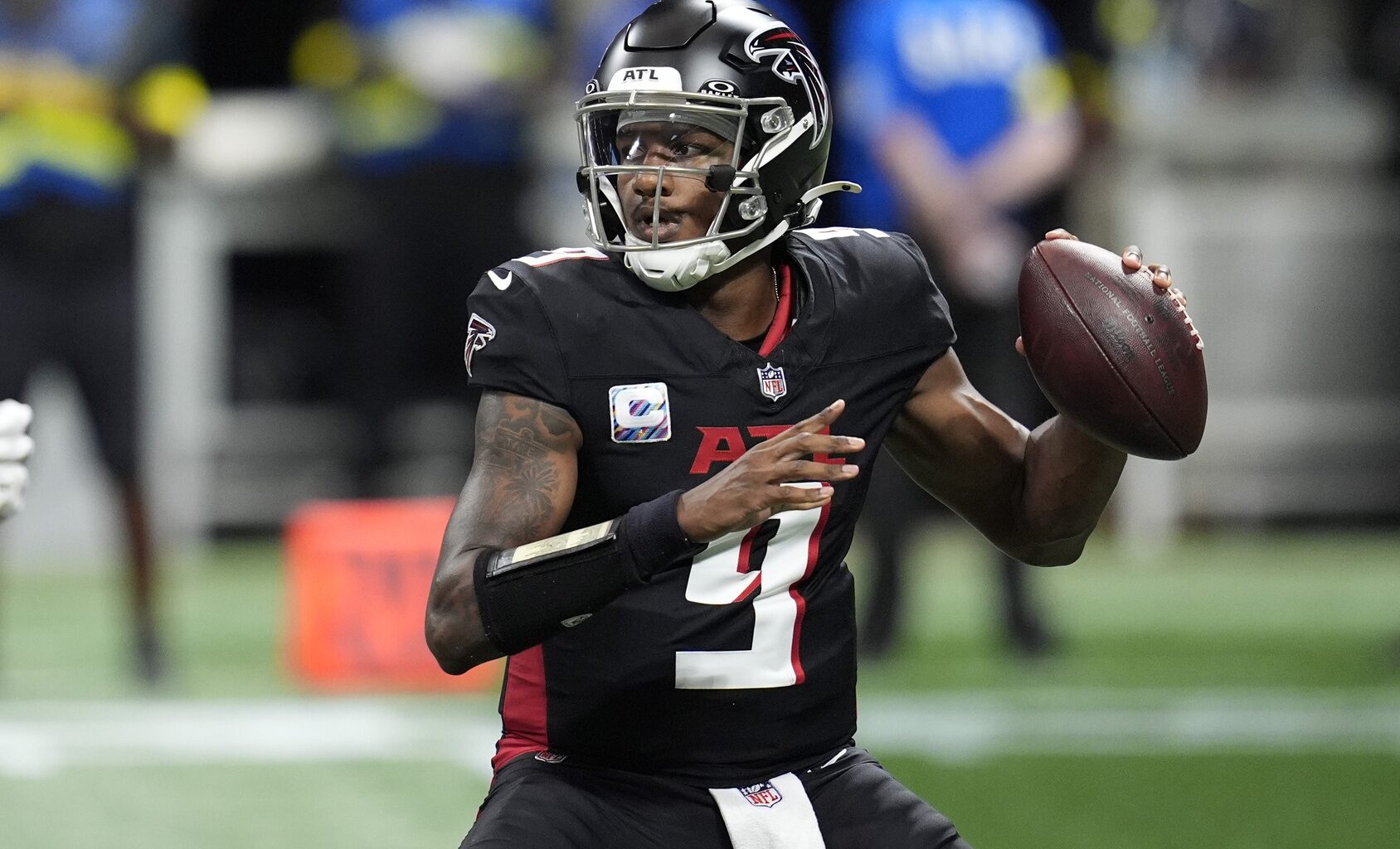 Falcons quarterback Michael Penix Jr. throws a pass against the Commaders during the 2025 season.