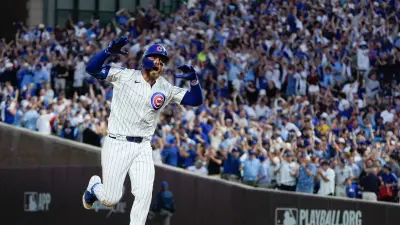 Oct 2, 2025; Chicago, Illinois, USA; Chicago Cubs first baseman Michael Busch (29) runs the bases after hitting a one run home run during the seventh inning against the San Diego Padres during game three of the Wildcard round for the 2025 MLB playoffs at Wrigley Field. Mandatory Credit: