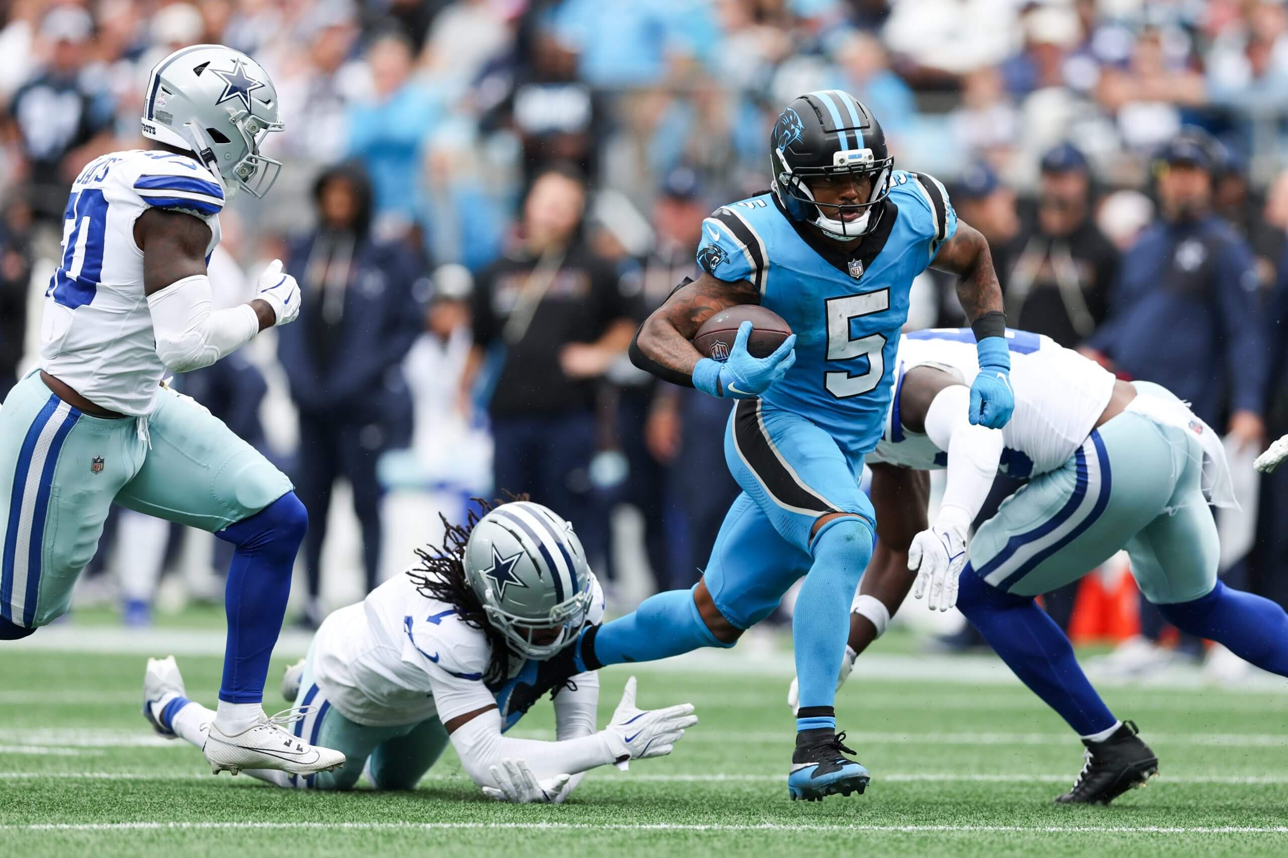 Panthers running back Rico Dowdle goes past and through three Cowboys defenders. 