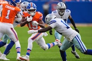 Denver Broncos wide receiver Marvin Mims Jr. (19) attempts to get past Dallas Cowboys safety...