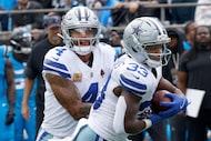 Dallas Cowboys quarterback Dak Prescott (4) hands off to Dallas Cowboys running back Javonte...