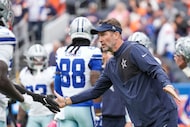 Dallas Cowboys head coach Brian Schottenheimer watches his team warm up before an NFL...