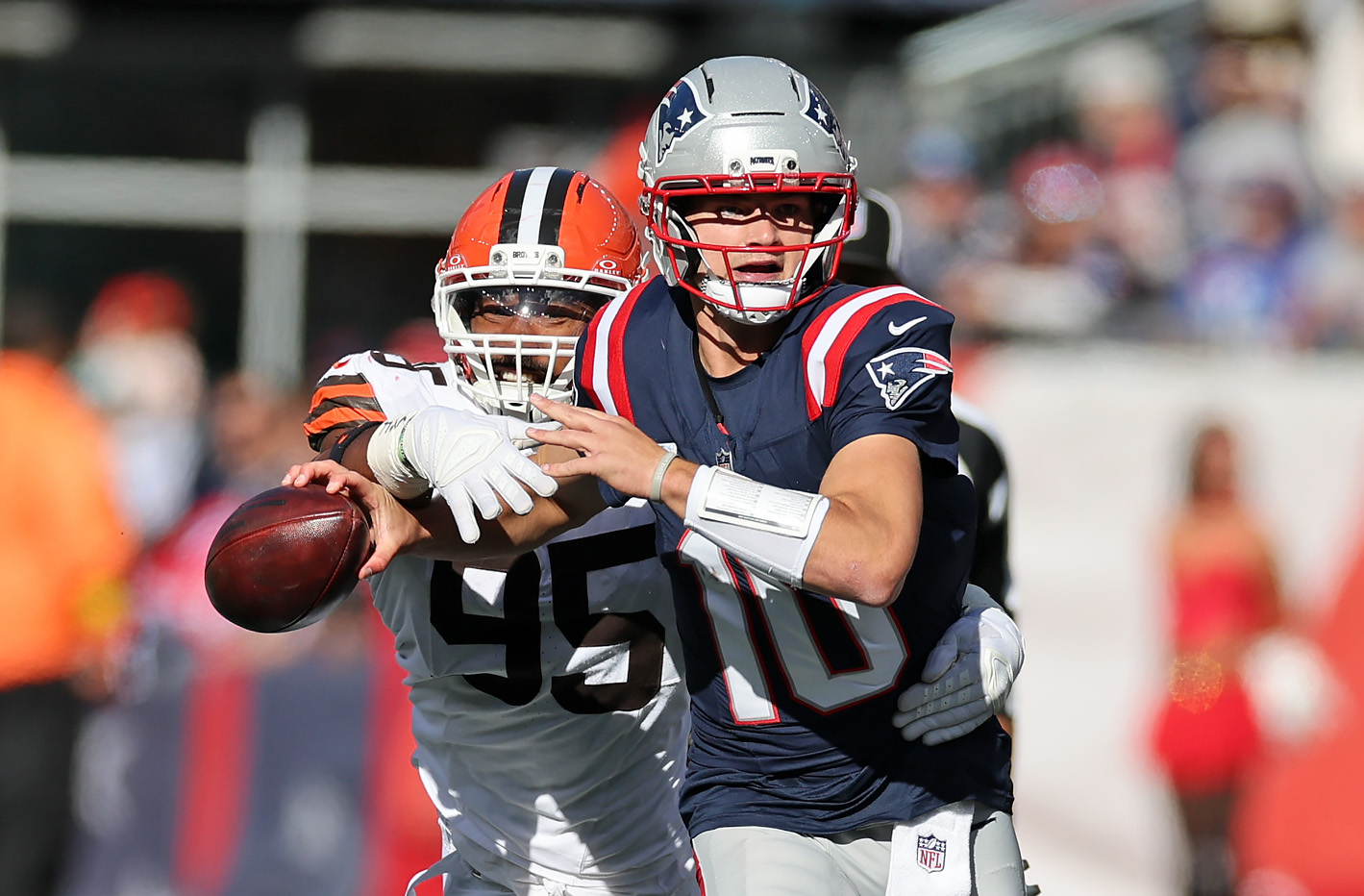 Cleveland Browns defensive end Myles Garrett strip sacks New England Patriots quarterback Drake Maye in the first half of play. 