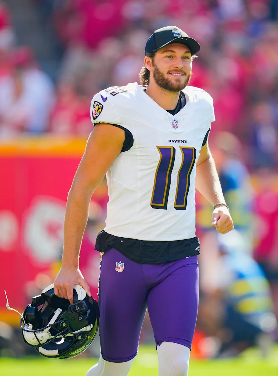 Sep 28, 2025; Kansas City, Missouri, USA; Baltimore Ravens punter Jordan Stout (11) takes the field prior to a game against the Kansas City Chiefs at GEHA Field at Arrowhead Stadium. Mandatory Credit: Jay Biggerstaff-Imagn Images
