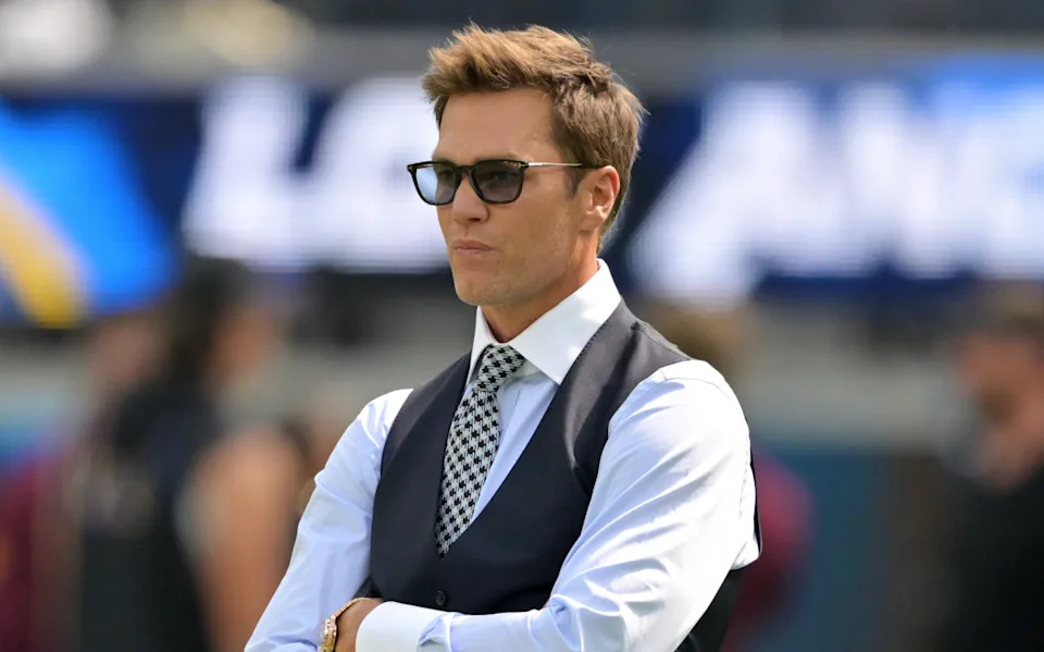 Former NFL quarterback Tom Brady looks on before the game between the Los Angeles Chargers and the Washington Commanders.Jayne Kamin-Oncea-Imagn Images