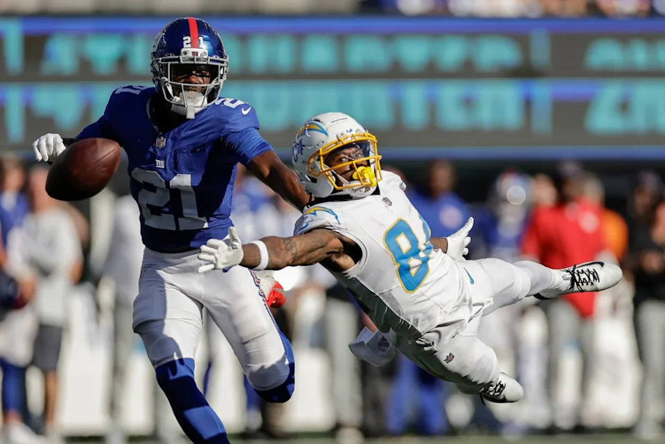 Cornerback Paulson Adebo, who will be facing his old team, the Saints, on Sunday, breaks up a pass intended for Keandre Lambert-Smith during the Giants’ Week 4 win over the Chargers. AP