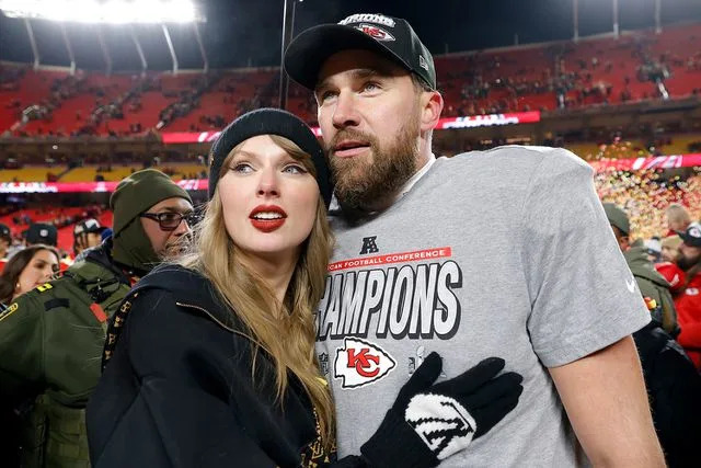 David Eulitt/Getty  Taylor Swift celebrates with Travis Kelce #87 of the Kansas City Chiefs after defeating the Buffalo Bills AFC Championship Game.