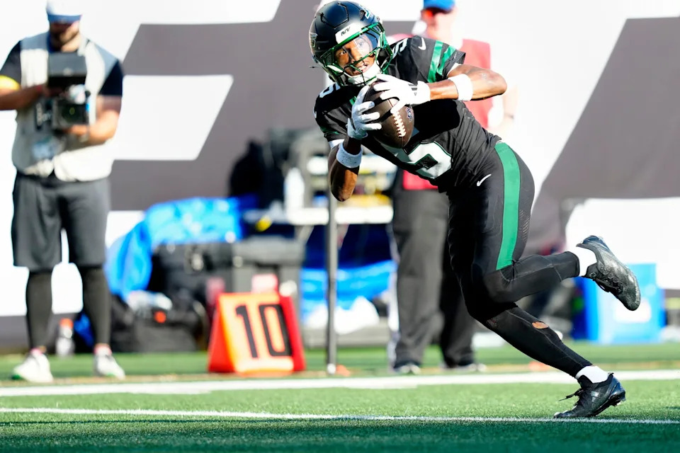 New York Jets wide receiver Garrett Wilson (5) completes a pass which he ran in for a touchdown, Sunday, October 5, 2025.