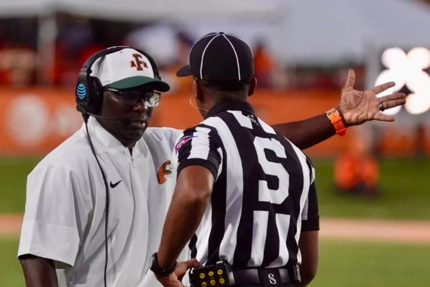 Florida A&M Rattlers head coach James Colzie III speaks with an official during an Week 3 NCAA football game versus the Albany State Golden Rams on Ken Riley Field at Bragg Memorial Stadium in Tallahassee, Florida, Saturday, Sept. 13, 2025.