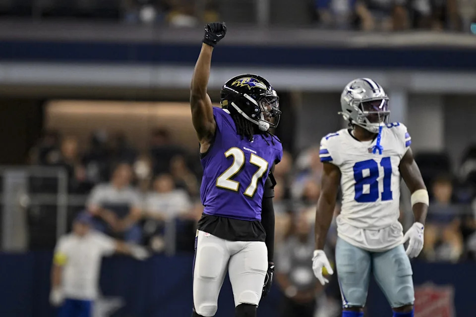 Aug 16, 2025; Arlington, Texas, USA; Baltimore Ravens cornerback T.J. Tampa (27) celebrates after the Ravens make a fourth down stop of the Dallas Cowboys during the second quarter at AT&T Stadium. Mandatory Credit: Jerome Miron-Imagn Images