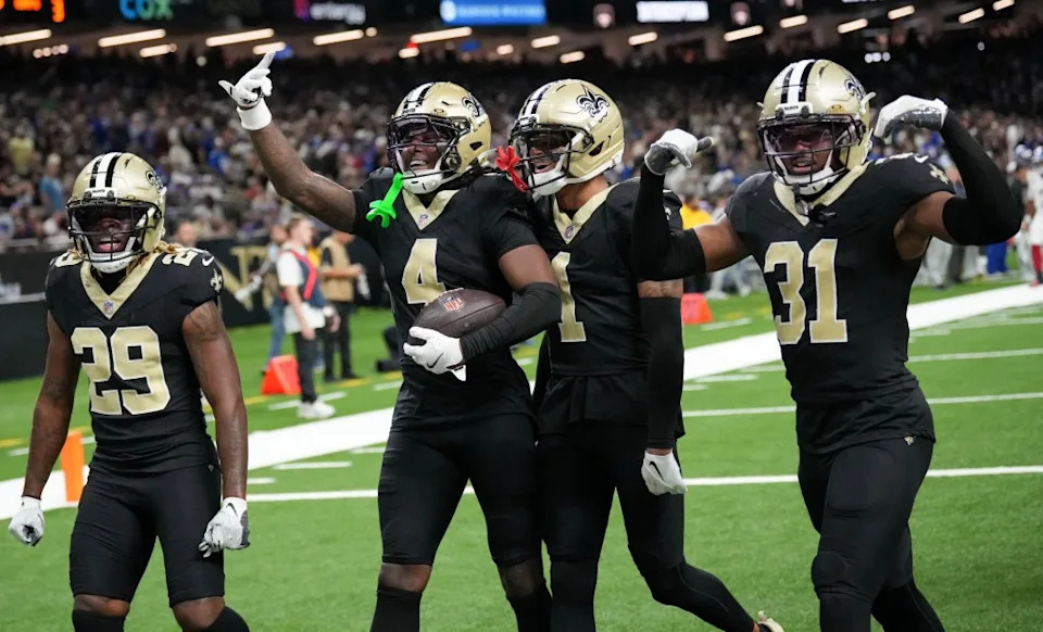 Kool-Aid McKinstry (4) celebrates with teammates after making his second interception of the game in the Saints’ Week 5 win over the Giants. Matthew Hinton-Imagn Images