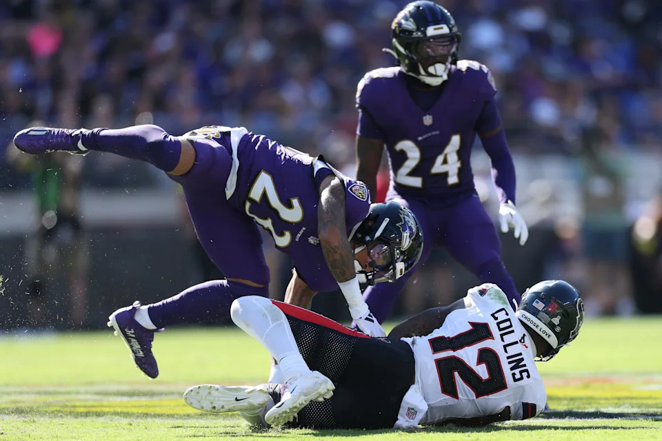 BALTIMORE, MARYLAND - OCTOBER 05: Nico Collins #12 of the Houston Texans is tackled by Jaire Alexander #23 of the Baltimore Ravens at M&T Bank Stadium on October 05, 2025 in Baltimore, Maryland. (Photo by Patrick Smith/Getty Images)