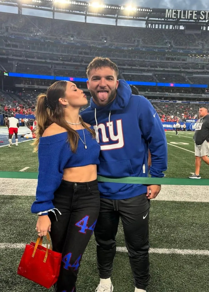 Cam Skattebo and his girlfriend, Chloe Rodriquez on the sideline at MetLife Stadium during the 2025 season. Instagram/Chloe Rodriguez
