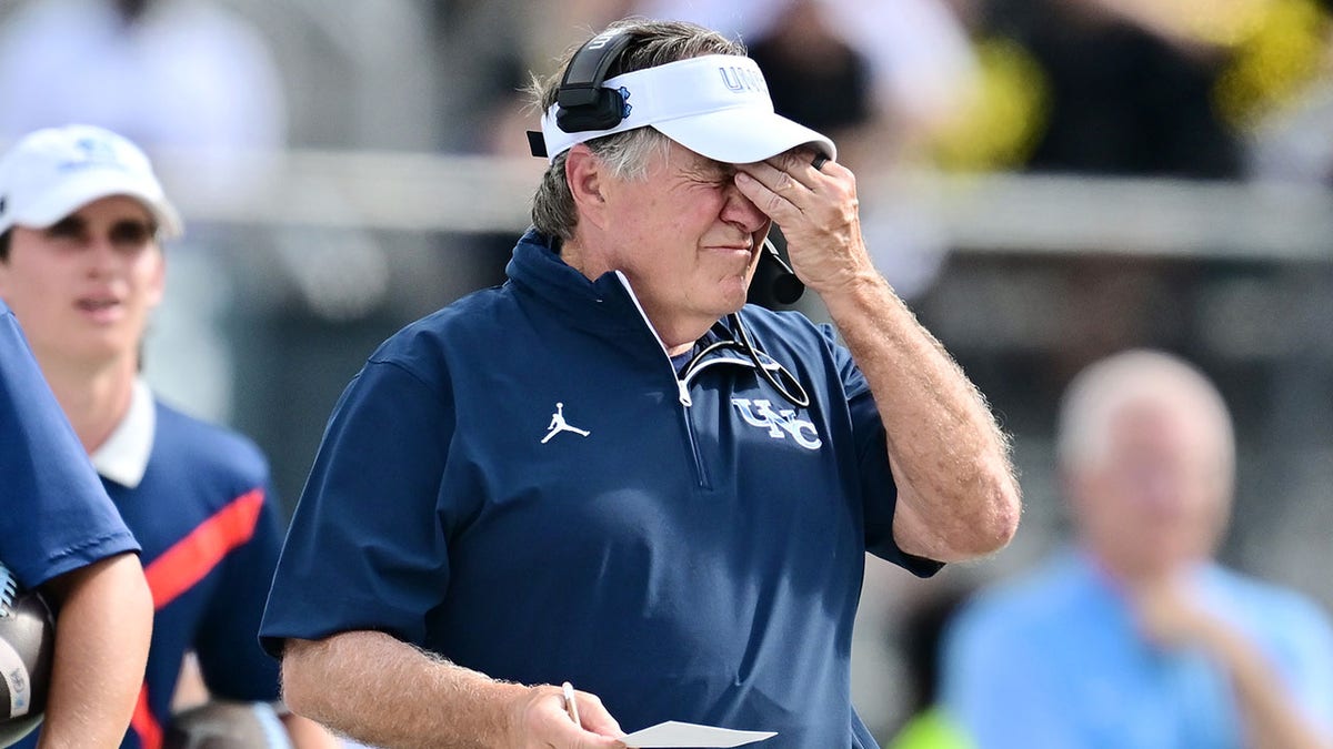 Bill Belichick touches face