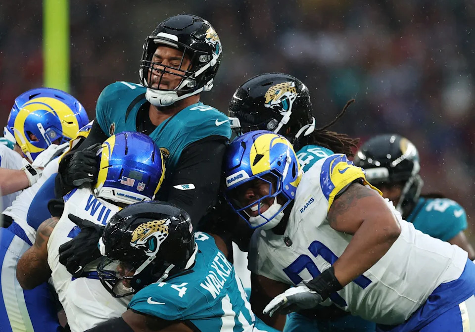 [US, Mexico & Canada customers only] Oct 19, 2025; London, United Kingdom; Jacksonville Jaguars defensive tackle Arik Armstead (91) gets tangled up with Los Angeles Rams running back Kyren Williams (23) and offensive tackle Warren McClendon Jr. (71) during the first half during a NFL International Series game at Wembley Stadium. Mandatory Credit: Andrew Boyers-Reuters via Imagn Images