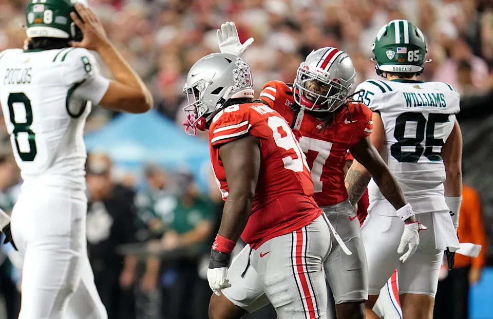 Ohio State Buckeyes cornerback Jermaine Mathews Jr. (7) celebrates a tackle by defensive lineman Kayden McDonald (98) during the NCAA football game against the Ohio Bobcats at Ohio Stadium on Sept. 13, 2025. Ohio State won 37-9.