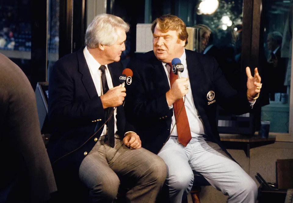 Dec 4, 1983; E. Rutherford, NJ, USA; FILE PHOTO; Broadcast team of Pat Summerall (left) and John Madden (right) at the St. Louis Cardinals at New York Giants game at Giants Stadium. Mandatory Credit: Herb Weitman-USA TODAY Sports